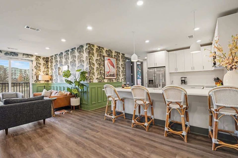 Fully equipped kitchen with stainless steel appliances and ample counter space with bar seating for 4 guests.