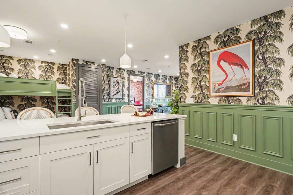 Fully equipped kitchen with stainless steel appliances and ample counter space with bar seating for 4 guests.