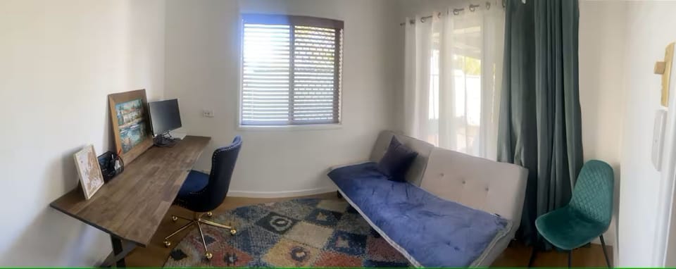 Work area with monitor, single sofa bed 