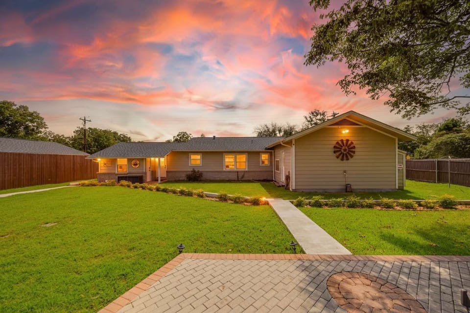 5 bedroom house backyard. Huge entertainment area with pool, hot tub, patio with covered dining and lighting.