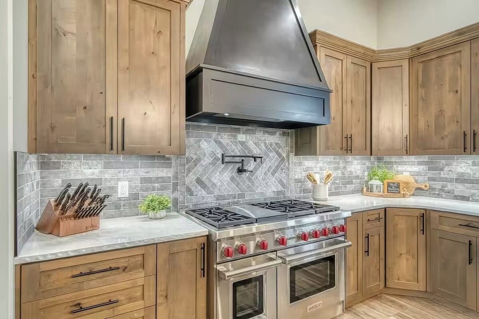 High-end kitchen with ample counter space, custom cabinetry, and chef layout.