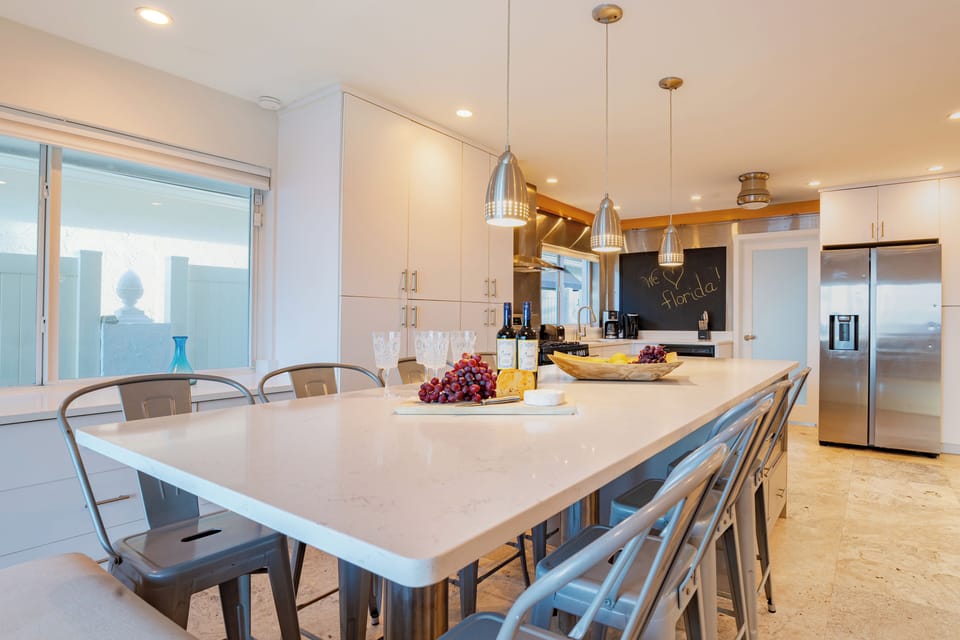 Stylish dining table illuminated by contemporary lighting.