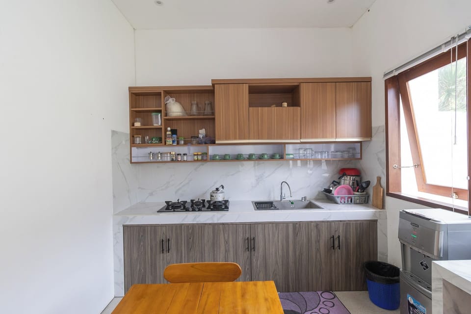 Deluxe Double Room | Private kitchen | Fridge, microwave, dining tables