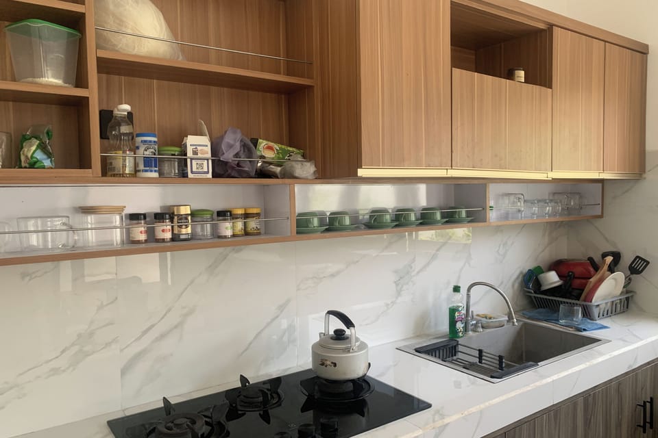 Deluxe Double Room | Shared kitchen facilities | Fridge, microwave, dining tables