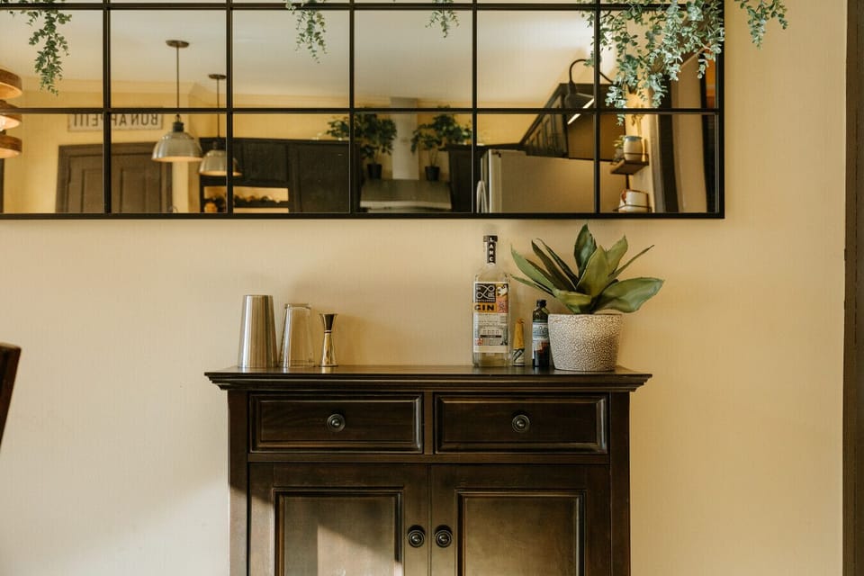 A small bar with everything you need to make a cocktail, just bring your favorite liquor!