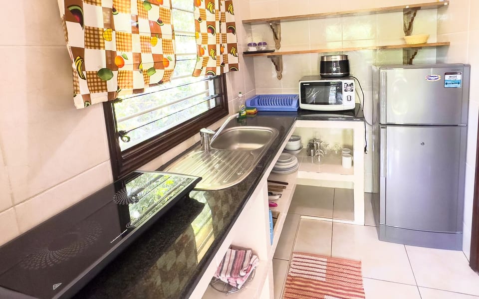 Apartment, 1 Bedroom (Coco Tann) | Private kitchen | Coffee/tea maker, fridge, microwave, stovetop