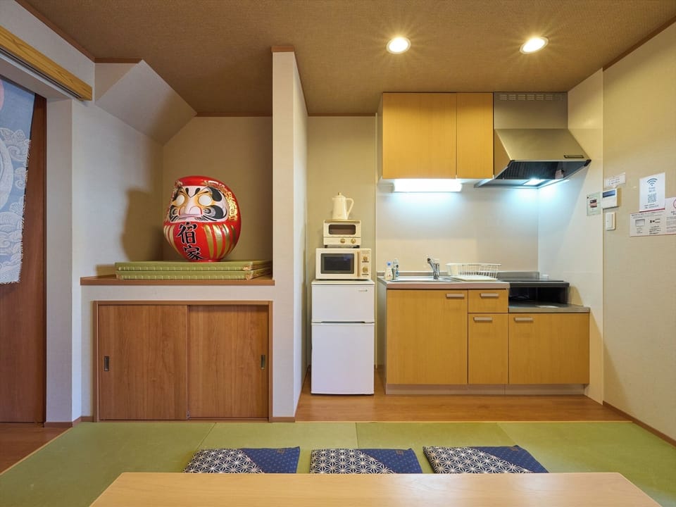 Basic Apartment | Private kitchen | Stovetop, electric kettle, cookware/dishes/utensils, freezer