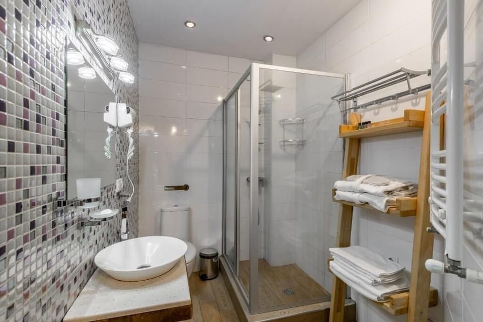 Luxury Suite, 1 King Bed with Sofa bed, Balcony, City View | Bathroom | Shower, hair dryer, bathrobes, slippers