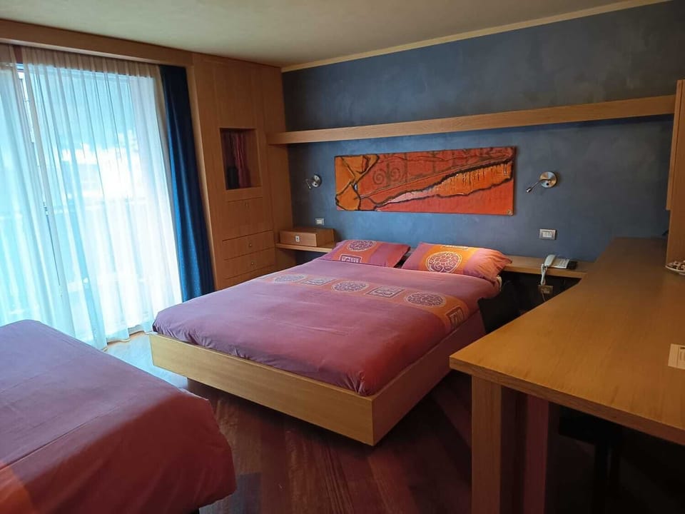 Superior Quadruple Room | In-room safe, desk, blackout drapes, soundproofing