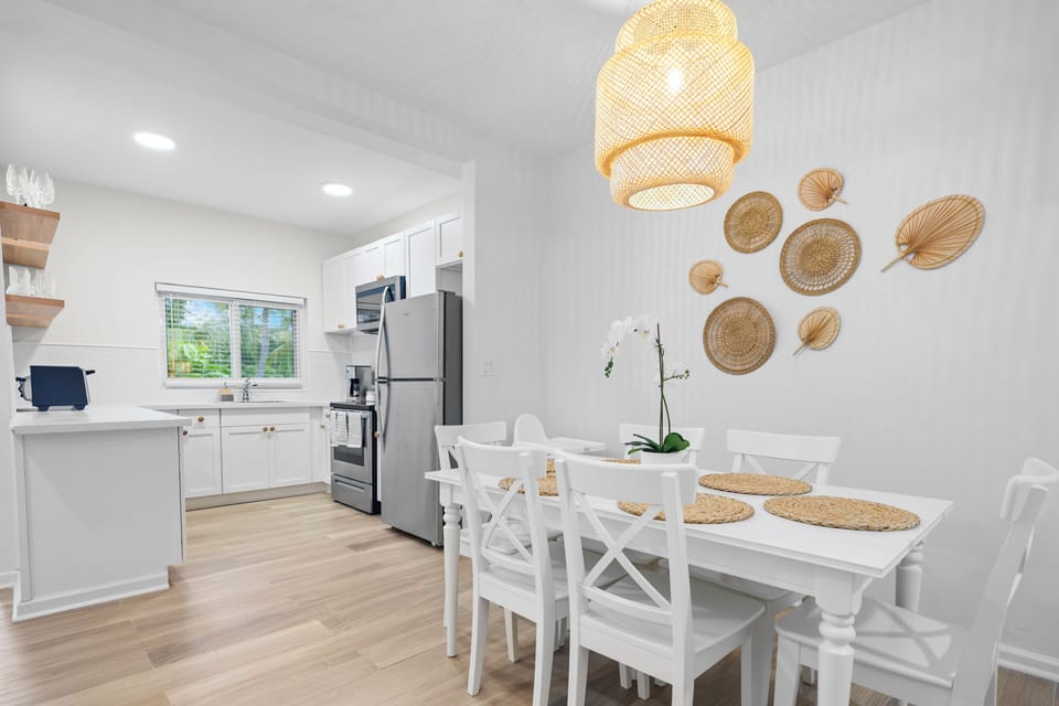 Dining area connected to open kitchen and living area. Kitchen table seats 6.  