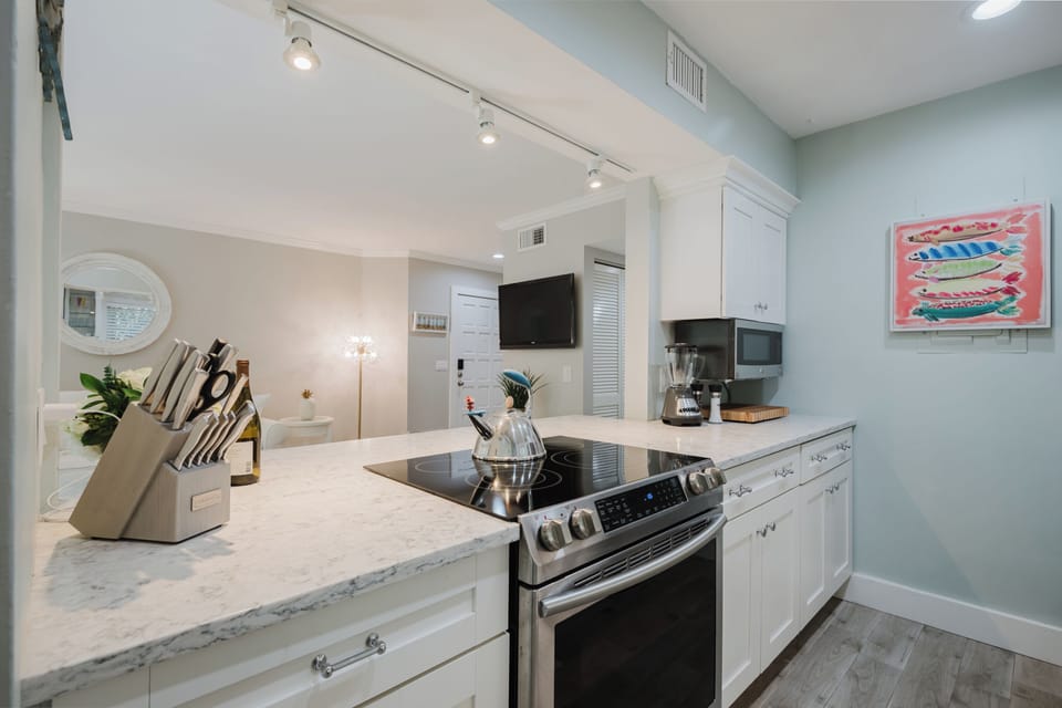 Kitchen includes dishes, pots & pans, blender, toaster, rice steamer & spices.