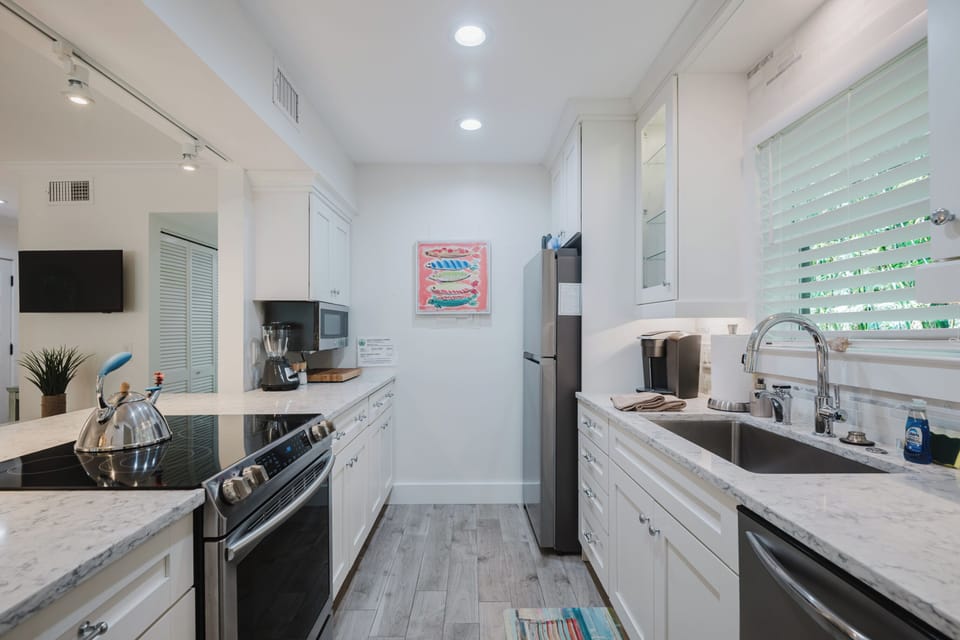 Full size refrigerator, freezer, microwave dishwasher and coffee makers.