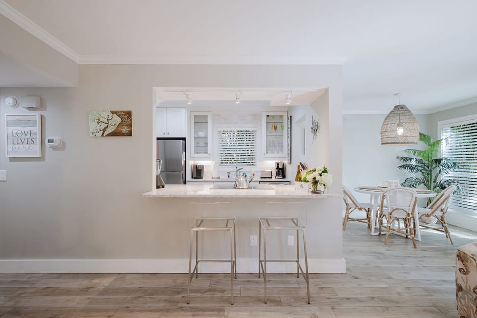 Kitchen pass-through with casual bar seating.