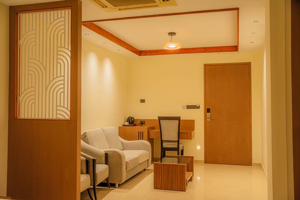 Premium Room | Living area | 32-inch LED TV with satellite channels