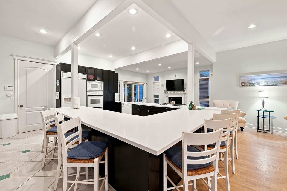 Cook together while everyone stays connected across the open living space.