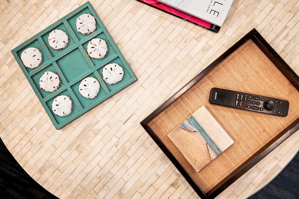 Tic-tac-toe and reading material offer easy entertainment between outings.