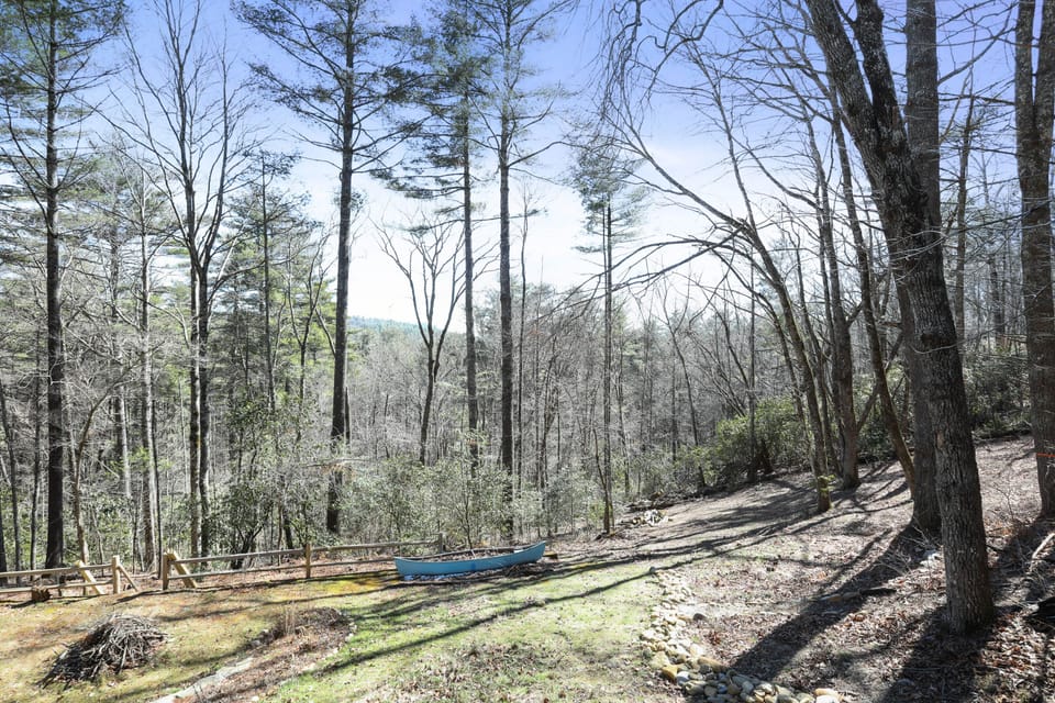This open stretch of mountain hillside is pure possibility. Morning sun filters through the trees, birds call from the canopy, and the quiet wraps around you like a favorite blanket. Whether you're sipping coffee at the edge or stargazing after dark, this is your place to simply *be*.