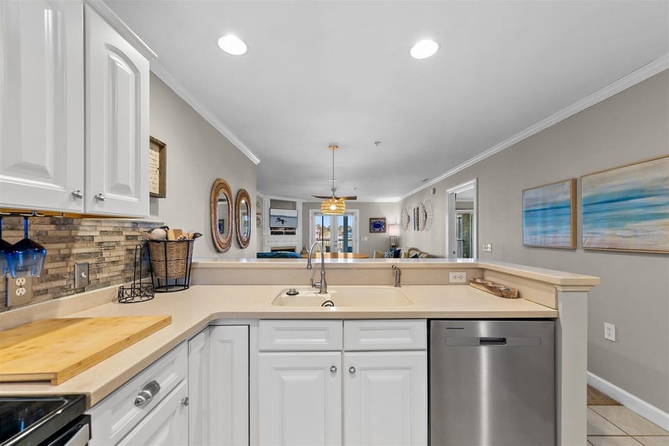 The fully-equipped kitchen invites culinary adventures with modern appliances, loads of counterspace, and an open flow to the living area