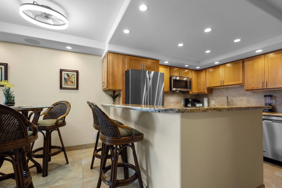 Gather around your spacious kitchen island with granite countertops and modern appliances, perfect for morning coffee or evening conversations.