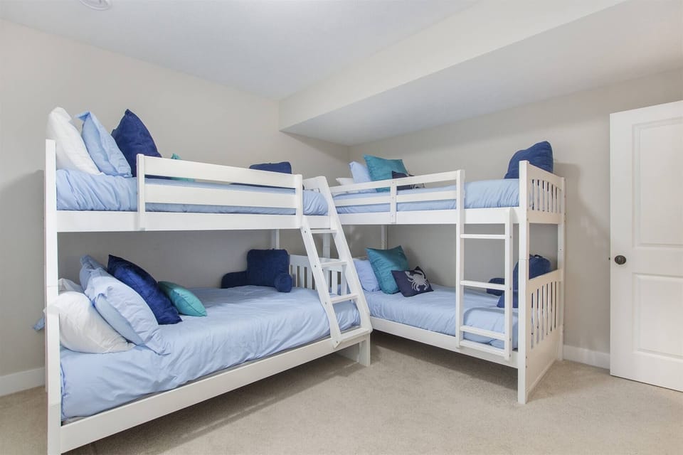 Fun and spacious bunk room featuring a twin over twin bunk and a queen over queen bunk.