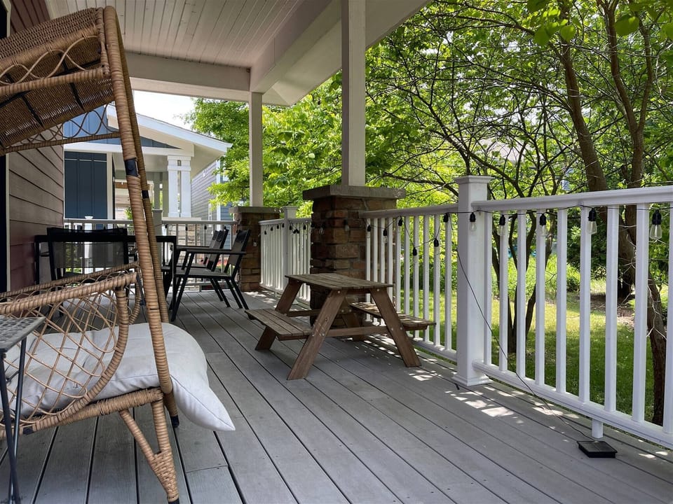 Relax on the peaceful covered porch featuring coz seating and a small picnic table.