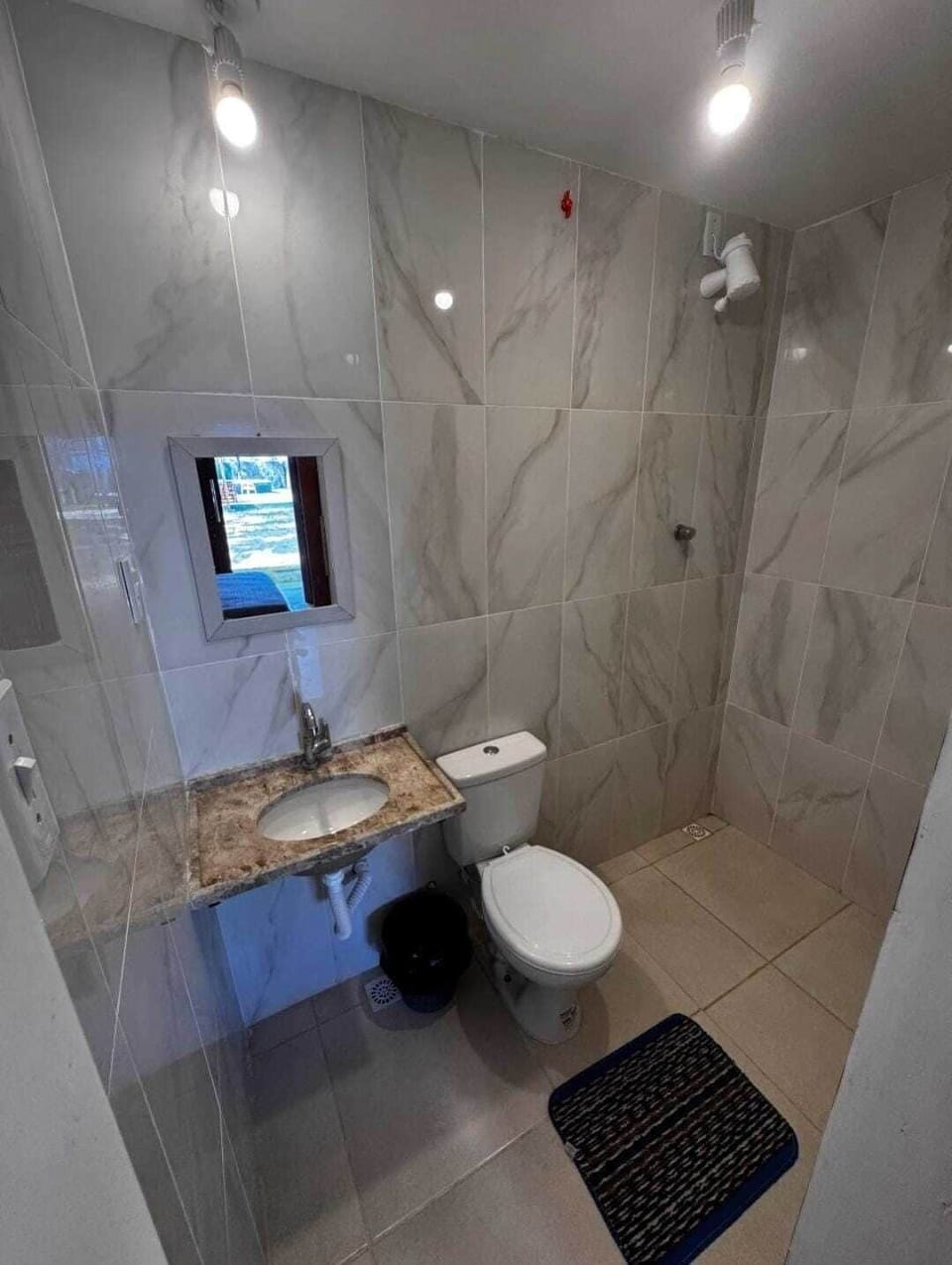 Shower, towels, soap, toilet paper
