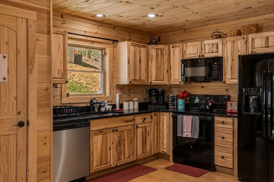 Another view of the kitchen displaying all the appliances you`d need to make a breakfast for the family and brew some fresh coffee all without having to leave the property.