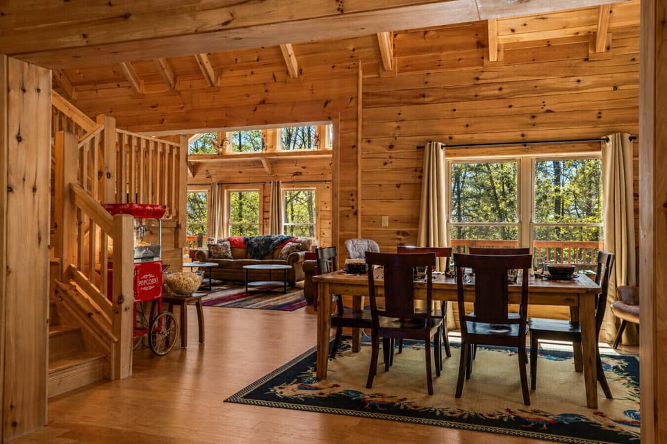 Bright and open space that brings together dining, kitchen, and seating areas for a comfortable group stay. Imagine your view coming down the stairs in the morning to see everyone eating breakfast and sipping coffee planning the day!