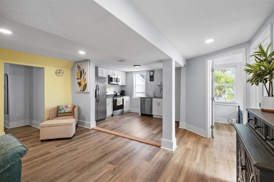 Feel how the living room flows right into the kitchen — no one gets stuck in a separate room when your group gathers here.