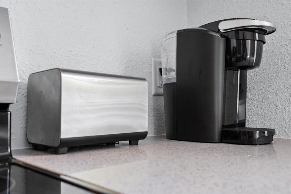 Start your morning right at the coffee station — the maker is loaded and the mugs are waiting for that first cup before you head out to explore.