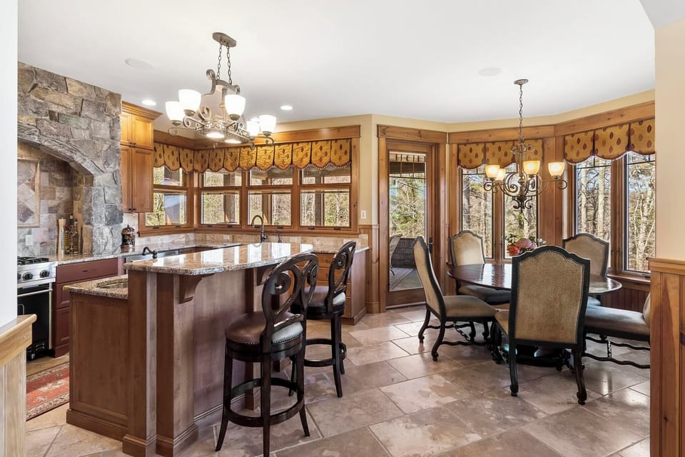 Main level chef's kitchen with island seating. 