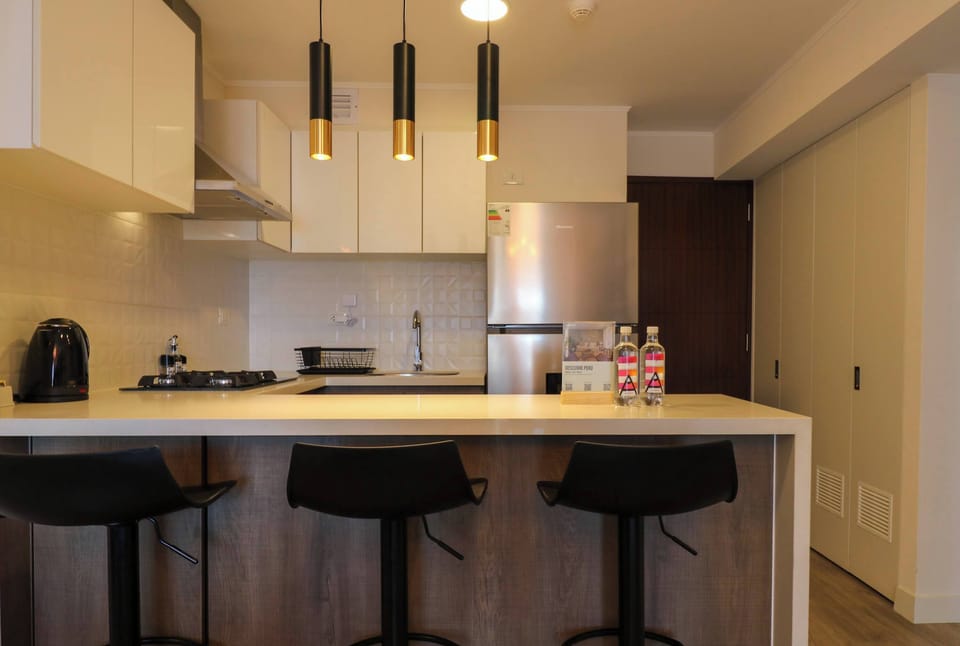 Modern kitchen island with bar seating, perfect for casual meals or morning coffee.