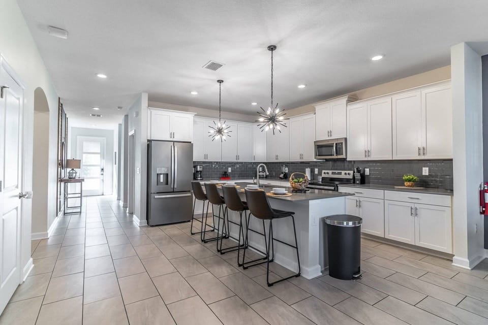 Kitchen area with bar seating for 4