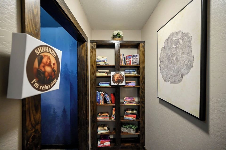 Tucked away for quiet moments, this charming reading nook offers a curated selection of books perfect for unwinding during your stay.