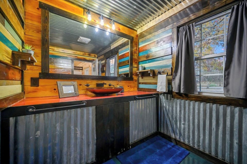 Whether you`re coming in from a swim or getting ready for a night of fun, this bathroom adds convenience right where you need it.