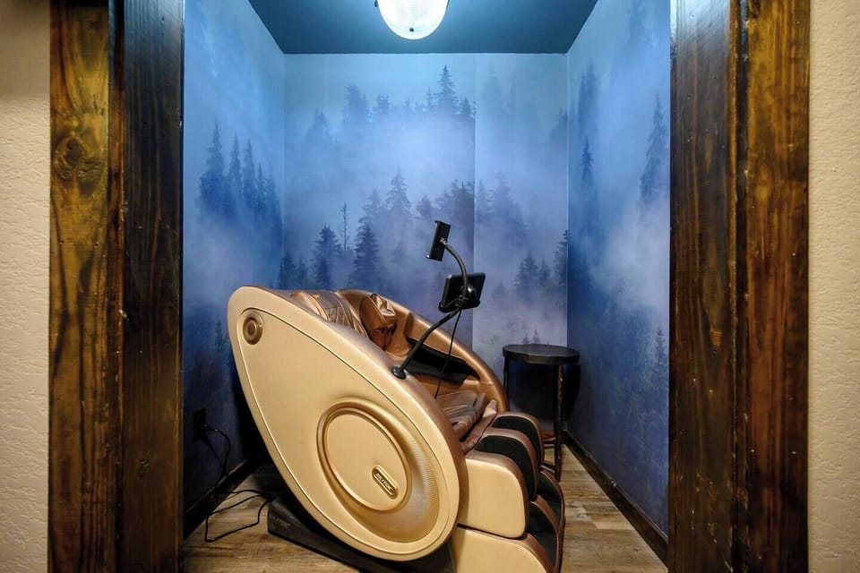Step into your own little escape and unwind in our luxurious full-body massage chair, tucked into a cozy, private nook designed for total relaxation.