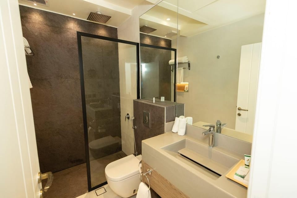 Deluxe Suite, Patio, Pool View | Bathroom | Bidet