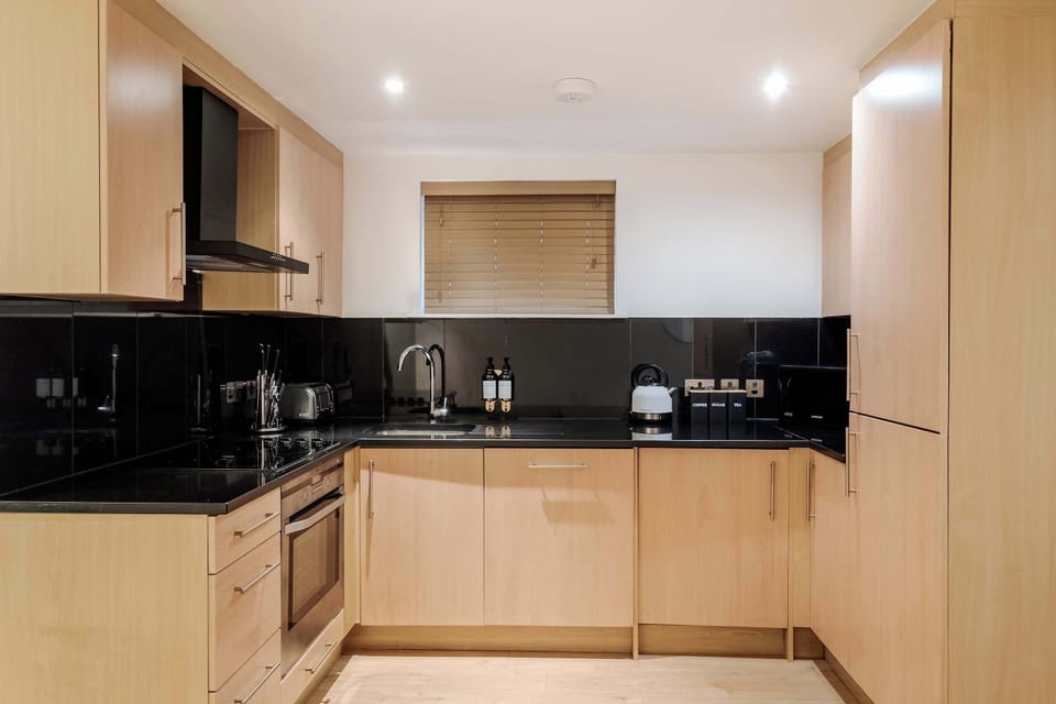 Full Kitchen | Fully equipped kitchen with everything you need for a short or long stay, including a fresh water dispenser, coffee machine, washing machine and dryer, and a dishwasher.