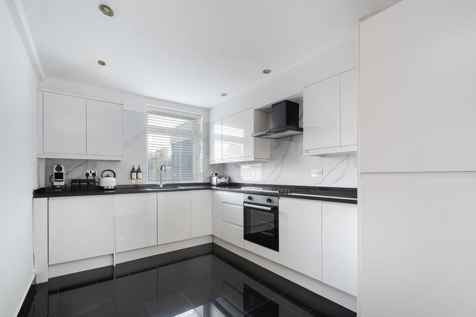 Full Kitchen | Fully equipped kitchen with everything you need for a short or long stay, including a fresh water dispenser, coffee machine, washing machine and dryer, and a dishwasher.