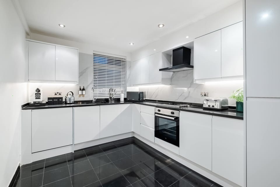 Full Kitchen | Fully equipped kitchen with everything you need for a short or long stay, including a fresh water dispenser, coffee machine, washing machine and dryer, and a dishwasher.