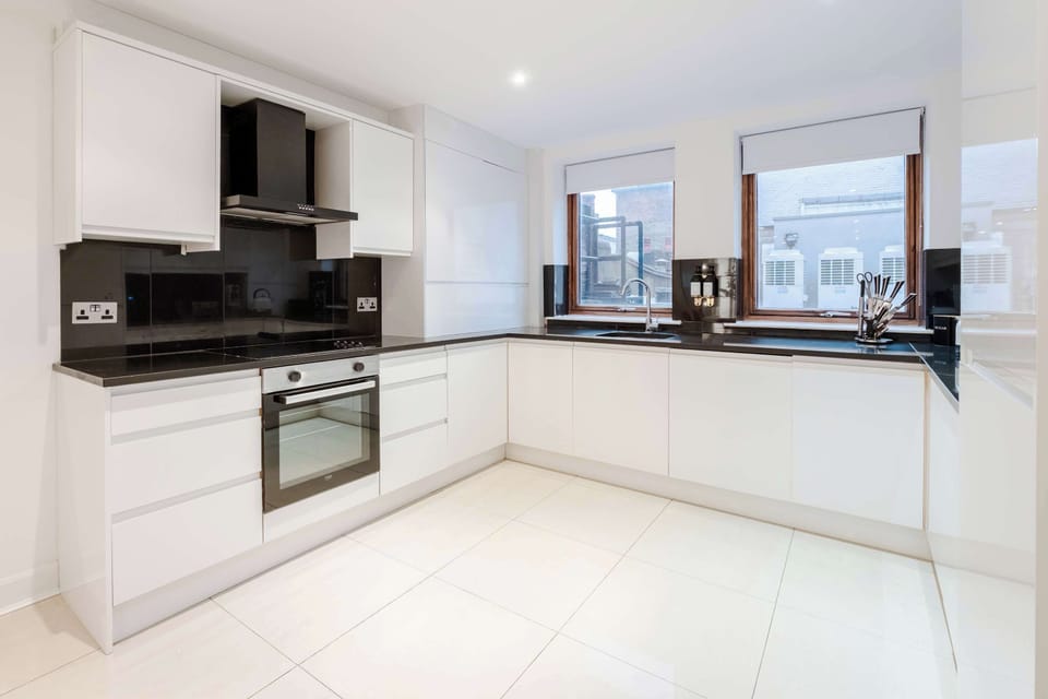 Full Kitchen | Savor the luxury of a fully-equipped kitchen, designed for any duration of stay. Revel in modern conveniences such as a washer, dryer, dishwasher, Nespresso machine, and a fresh water dispenser, ensuring your comfort and convenience.