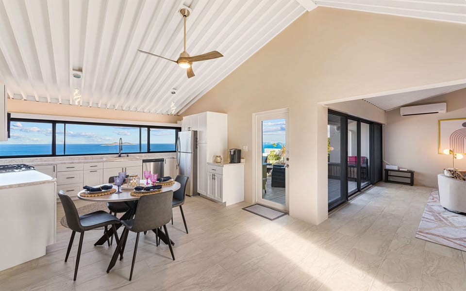 This modern kitchen is conveniently located off of the patio and living room