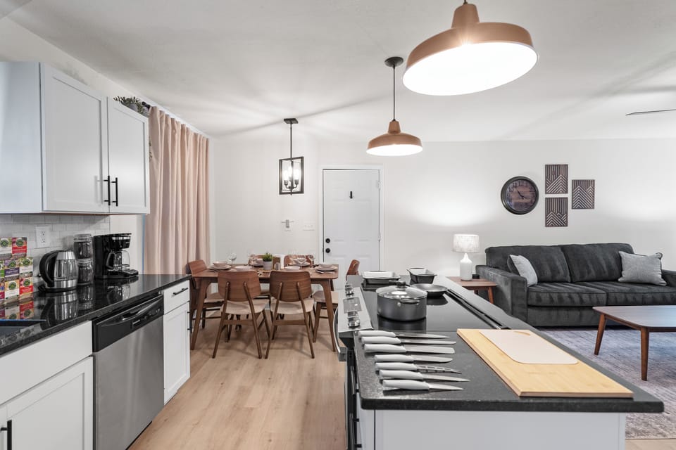 Bright Open-Concept Kitchen, Dining, and Living Area with Modern Finishes