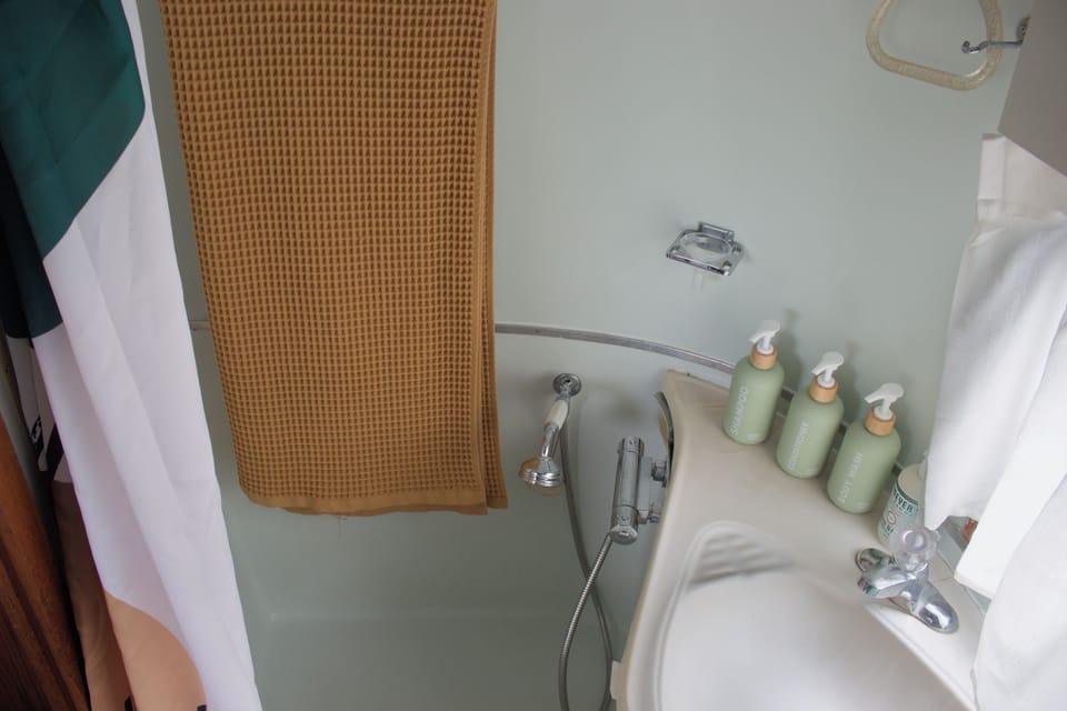 Clean, guest-ready bathroom with stocked toiletries and tub shower