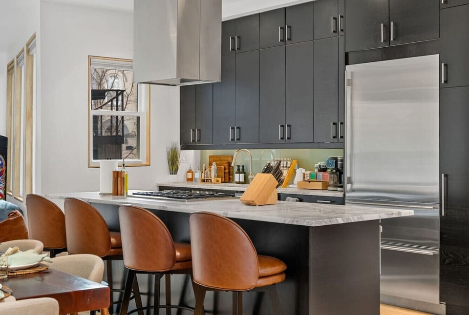 Fully equipped kitchen with bar seating.