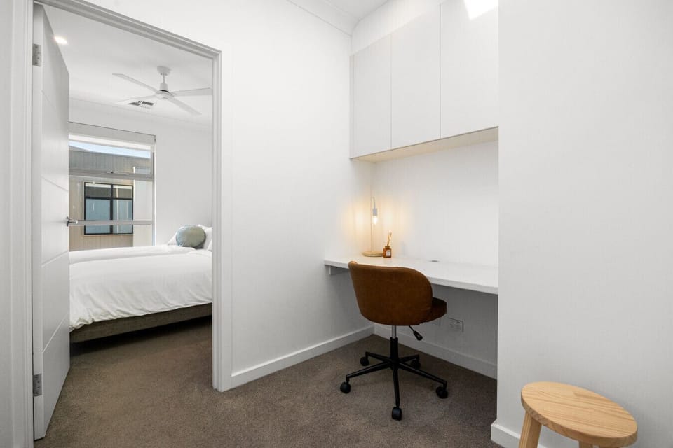 Set up your laptop at the dedicated workspace, offering a quiet spot for study or remote work.