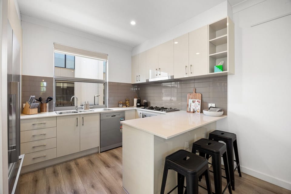 Cook with ease in the open-plan kitchen, equipped with full appliances and plenty of bench space for shared meals.