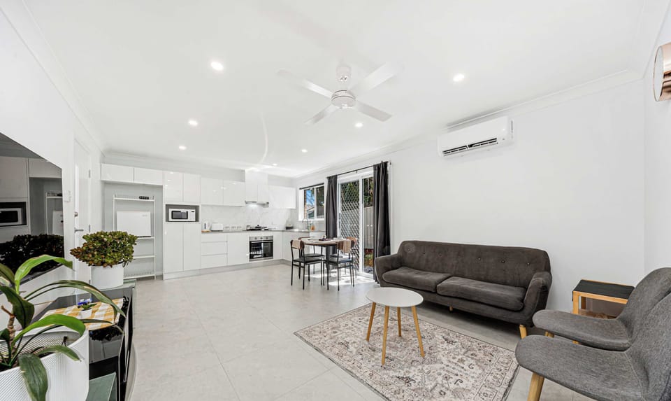 Bright and airy living space with comfortable seating and an open-plan layout — perfect for relaxing and entertaining.