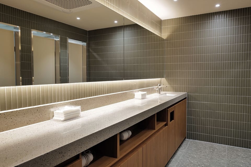 Shower, hair dryer, slippers, towels