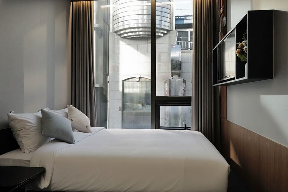 Double Room, City View | Blackout drapes, soundproofing, iron/ironing board, free WiFi
